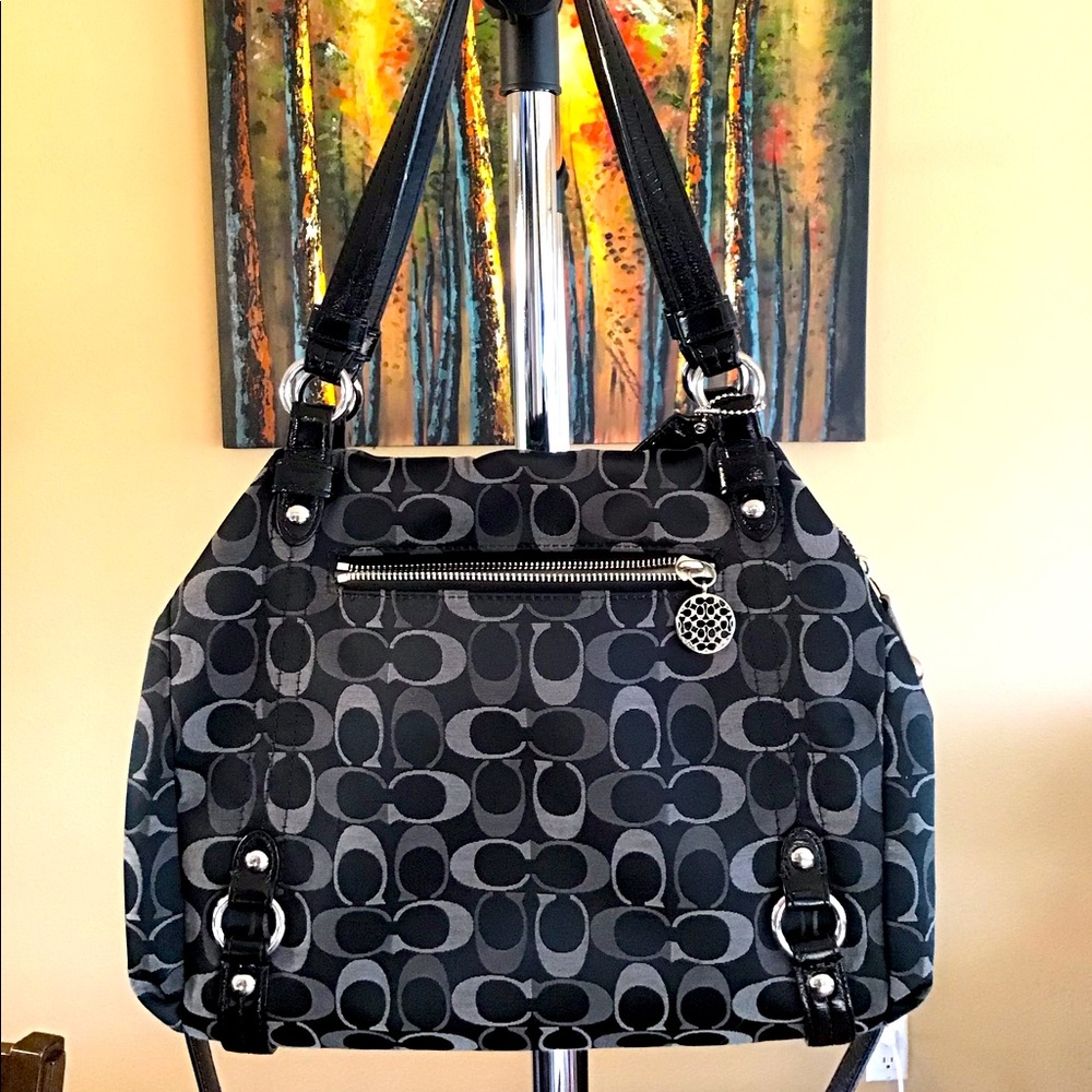 Beautiful black and gray Coach shoulder purse. Has strap to wear as crossbody.